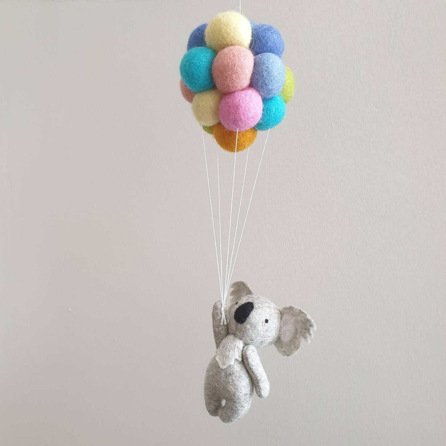 Little Koala holding Pastel Rainbow Balloons