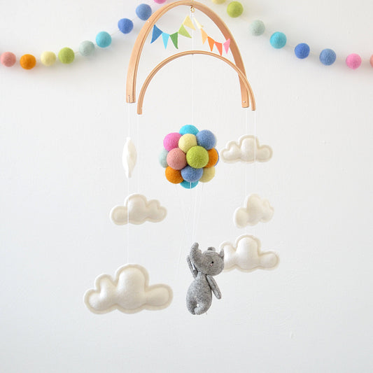 Rhino Flying with rainbow balloons
